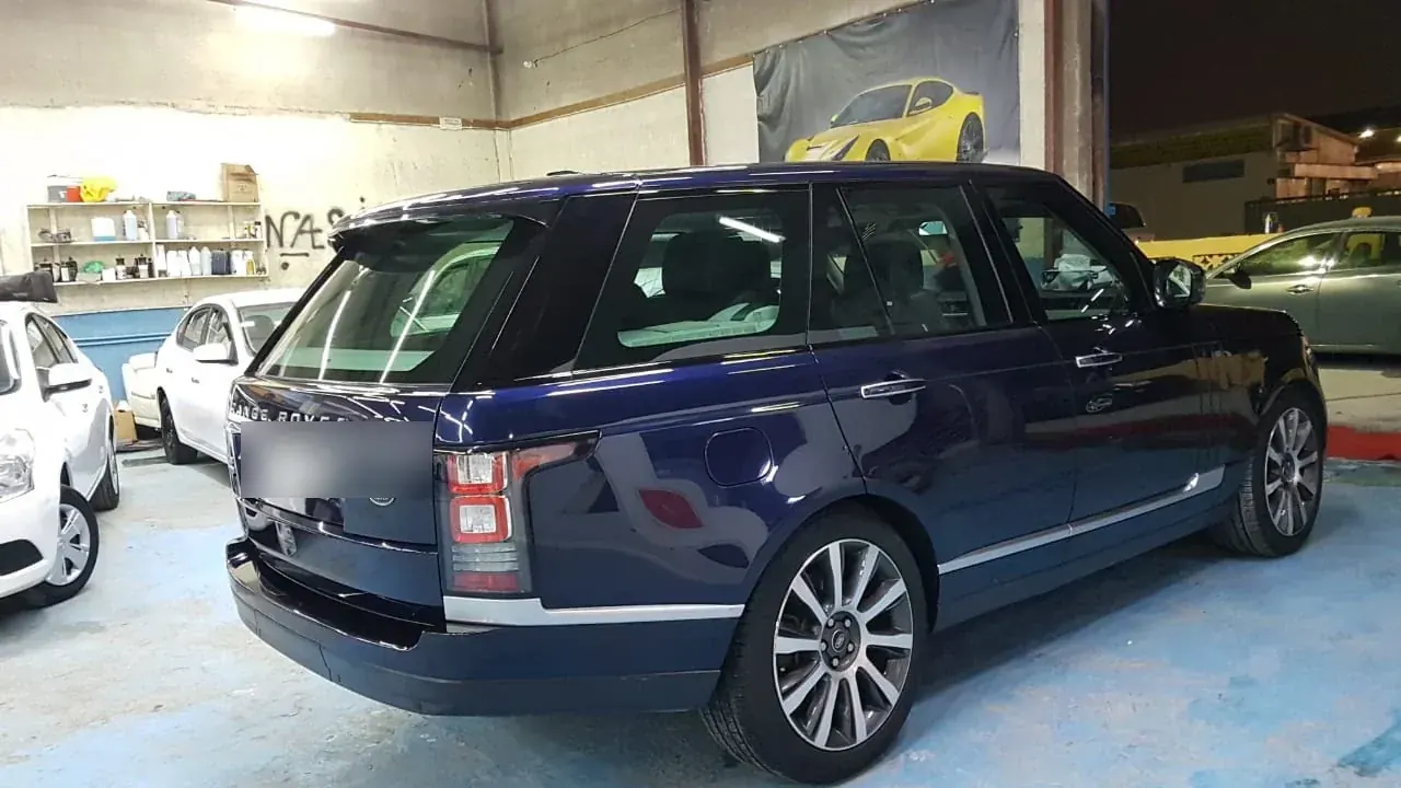 Navy Range Rover Vogue serviced at Madeena Al Amwaj Auto Workshop