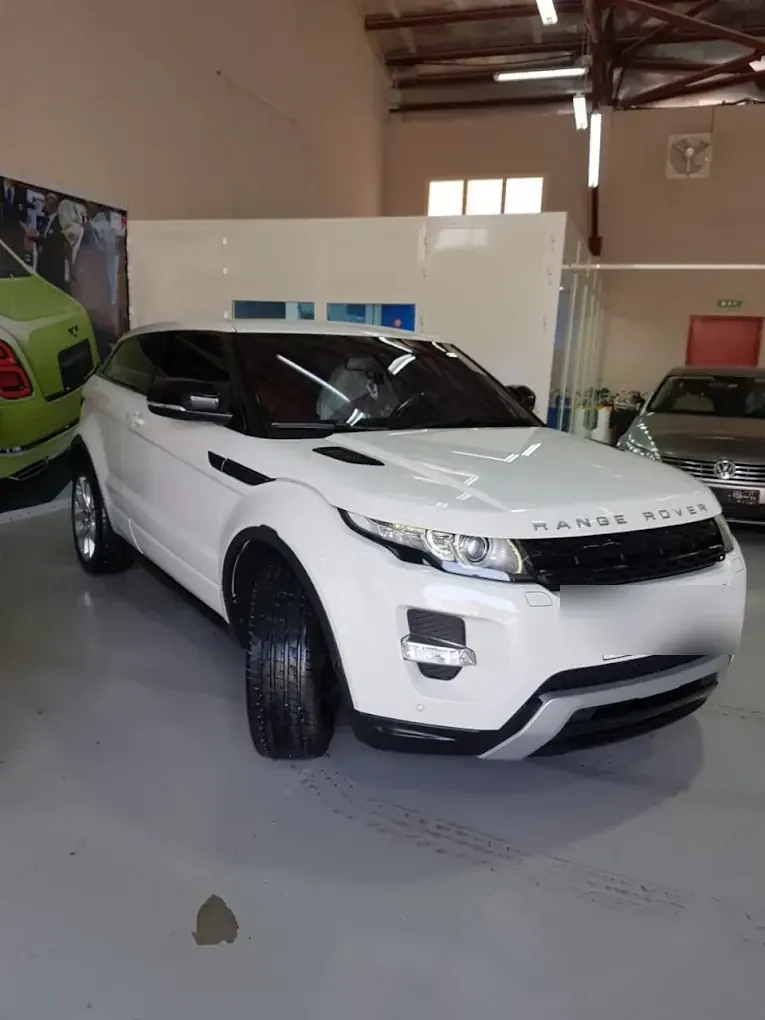 White Range Rover Evoque at Madeena Al Amwaj Auto Workshop